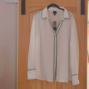 White blouse black trim